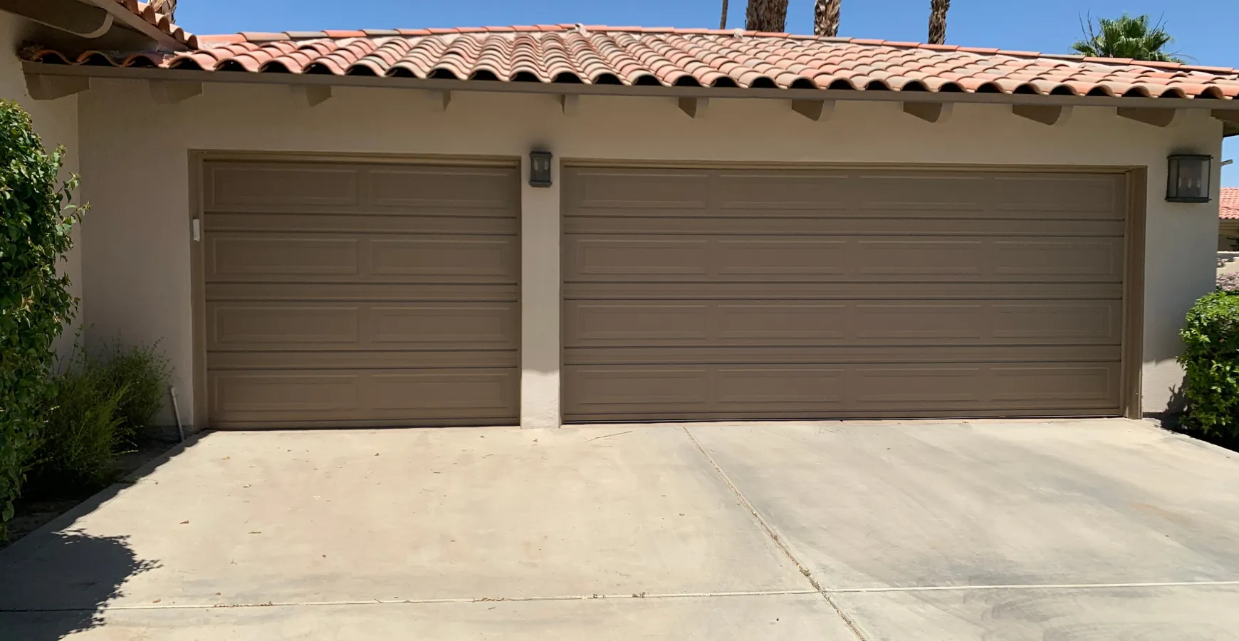 Garage before ADU conversion in Los Angeles with double garage doors and unused parking space
